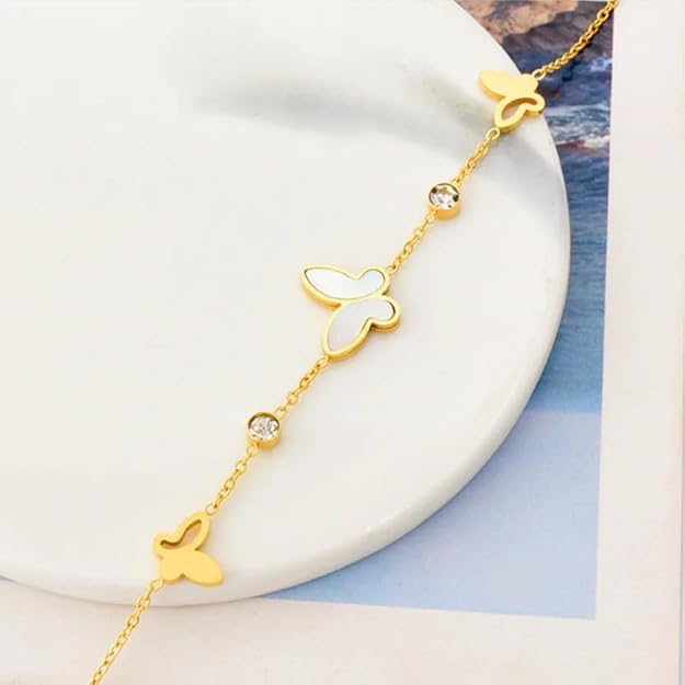 Elegant gold butterfly bracelet adorning a woman's wrist, a chic and feminine accessory.