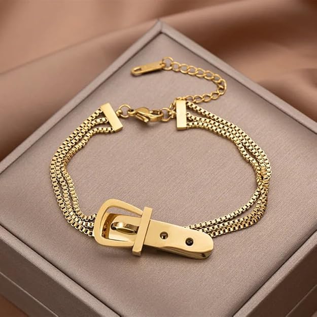 A shiny gold plated bracelet with a buckle, perfect for adding a touch of elegance to any outfit.