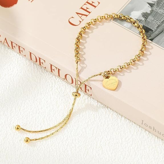 Gold plated bracelet with heart charm, perfect accessory for a special occasion.