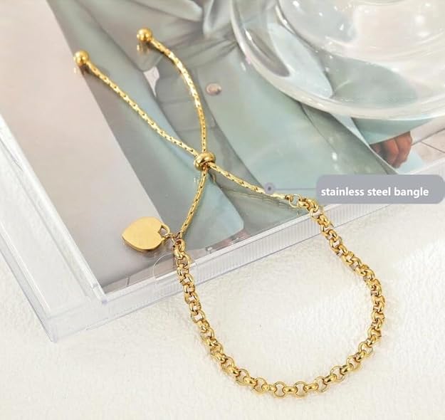 Gold plated bracelet with a heart charm, a chic and meaningful addition to any outfit.