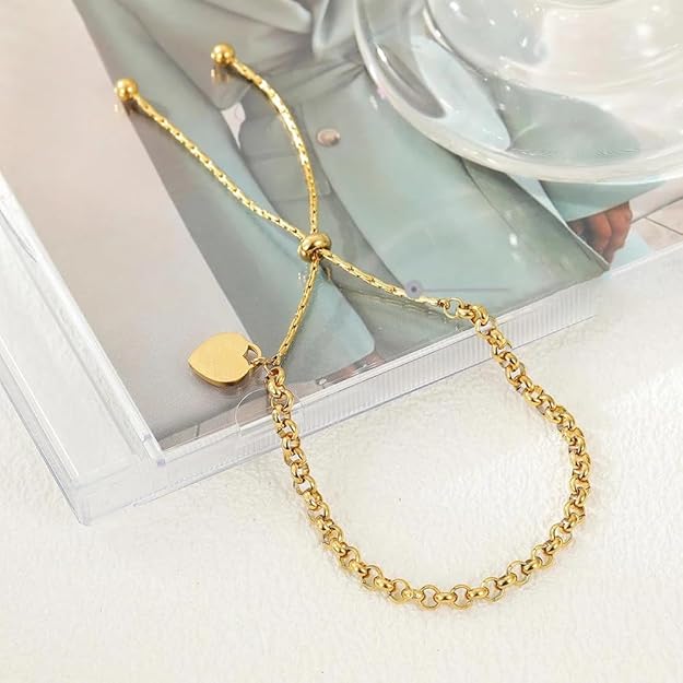 Stylish gold plated bracelet adorned with a heart charm, a symbol of love and sophistication.