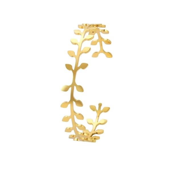  A stylish gold leaf cuff bracelet against a white backdrop.