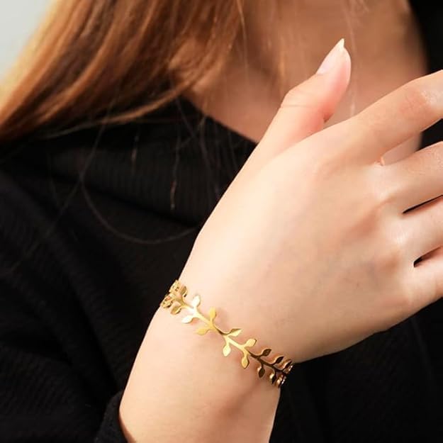 Add a touch of glamour with this gold leaf cuff bracelet, a timeless piece for any occasion.