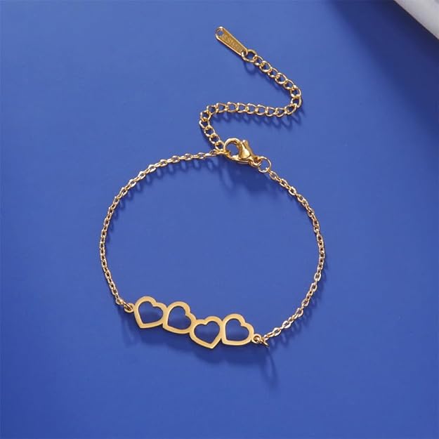 A bracelet made of gold with two heart shapes.