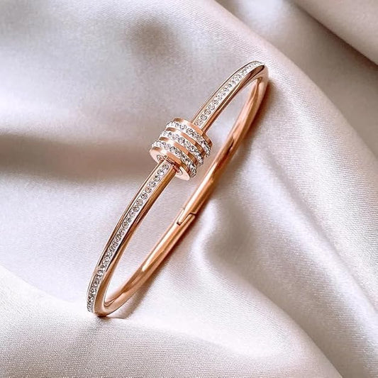 Shiny rose gold bracelet adorned with sparkling diamonds.