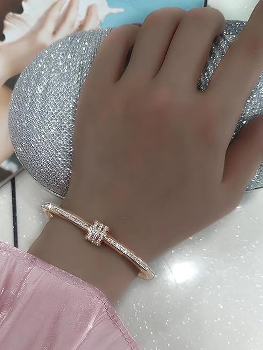  Stylish rose gold bracelet with shimmering diamond accents.