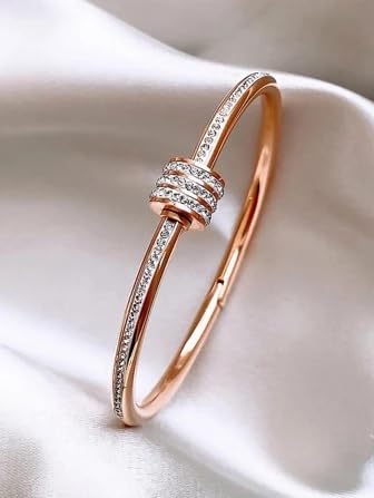 Rose gold bracelet with sparkling diamonds, perfect for adding a touch of elegance to any outfit.