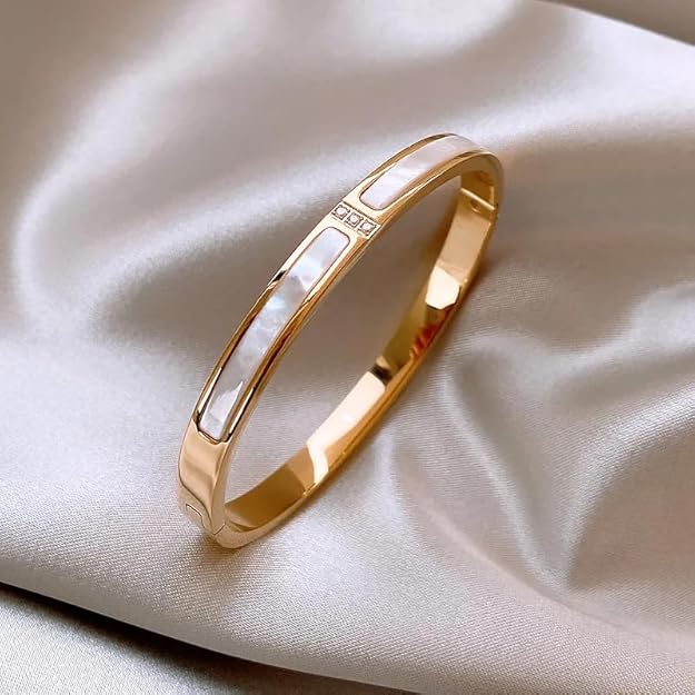 A gold bracelet accented by a dazzling diamond.