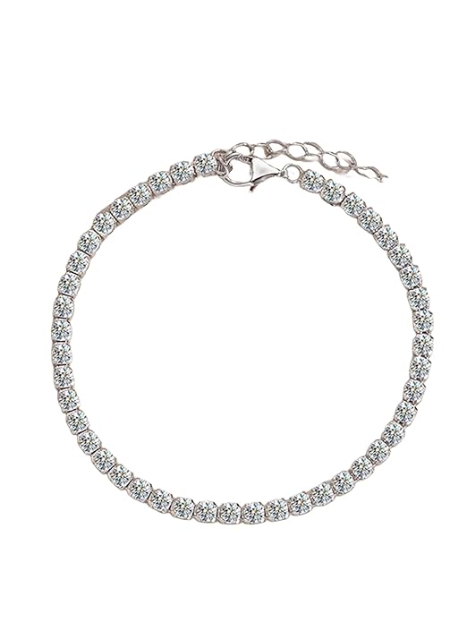 Shiny diamond tennis bracelet on blue surface.