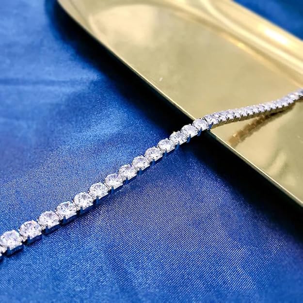 A sparkling diamond tennis bracelet on a blue background.