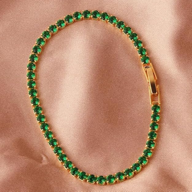 Elegant emerald green bracelet showcased in a white box.