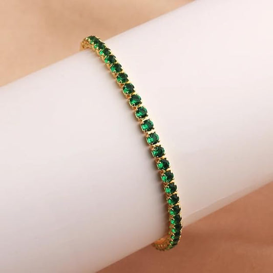 A stunning emerald green bracelet elegantly displayed in a white box.