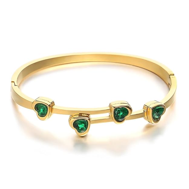 Luxurious gold plated bracelet adorned with stunning green stones, perfect for adding a touch of glamour.