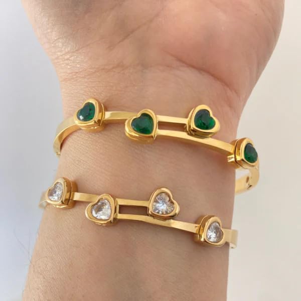  Stylish gold bracelet with eye-catching green stones for a chic look.