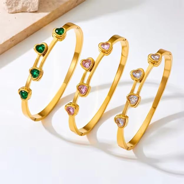 Gold plated bracelet with vibrant green stones, perfect for any occasion.