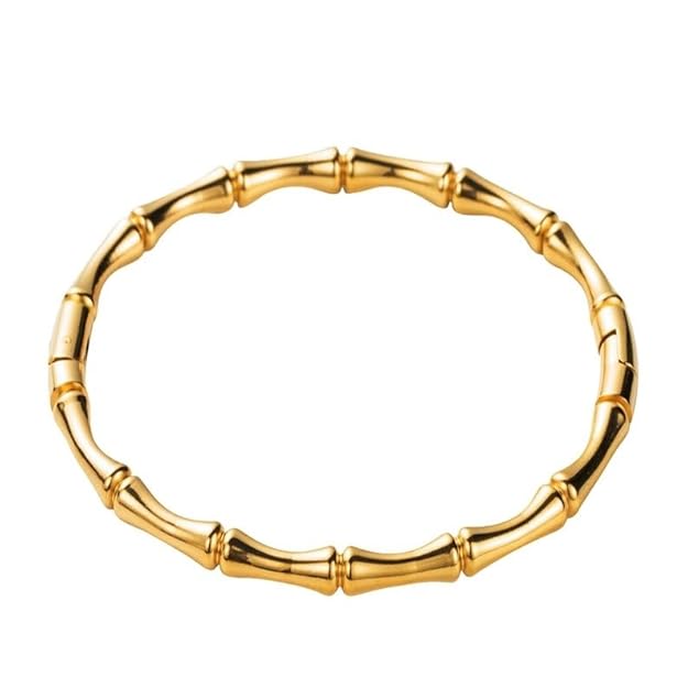 Elegant gold bracelet with intricate bamboo leaf pattern.