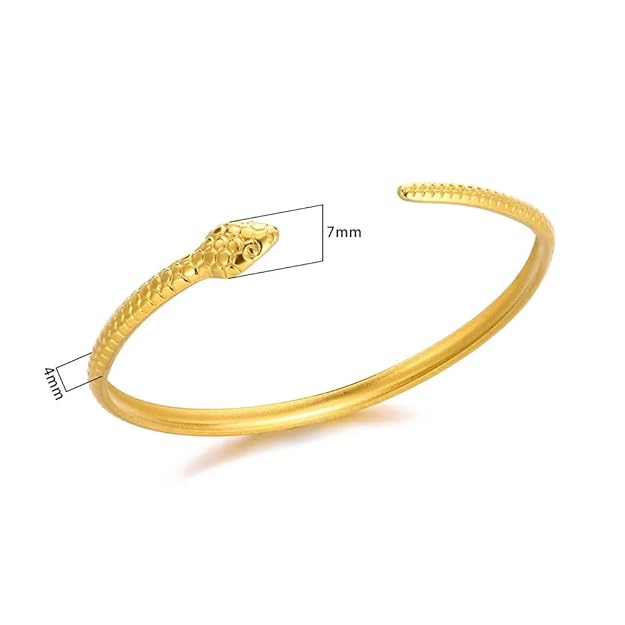 A gold snake bracelet on a box, perfect for a special occasion