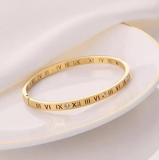 Gold bracelet with Roman numerals design.