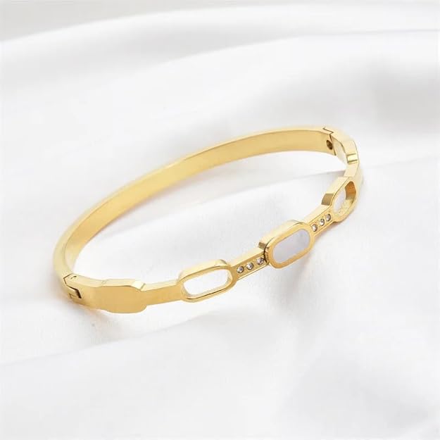 Shiny gold bracelet embellished with beautiful white stones.