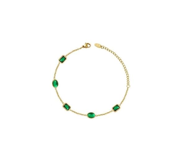  Elevate your style with this gorgeous gold bracelet accented with eye-catching green stones.