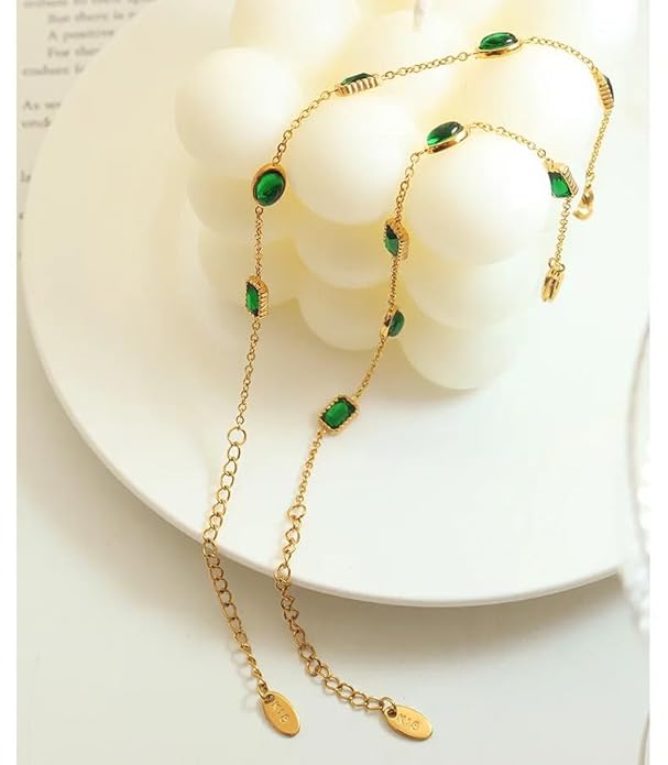 Elegant gold chain bracelet featuring stunning green stones, a chic addition to your jewelry collection.