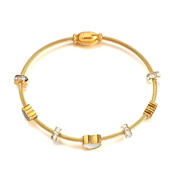 Elegant gold bracelet featuring a pattern of black and white hearts, perfect for adding a touch of charm to any outfit.