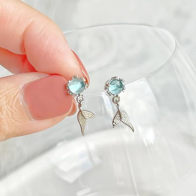 Exquisite sterling silver earrings adorned with blue topaz