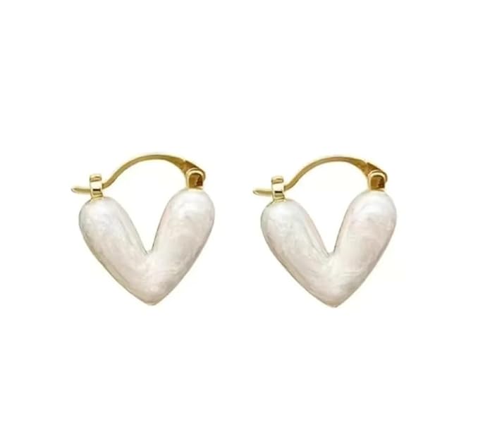  Chic white heart-shaped earrings on a beige surface, adding a subtle charm to your ensemble.