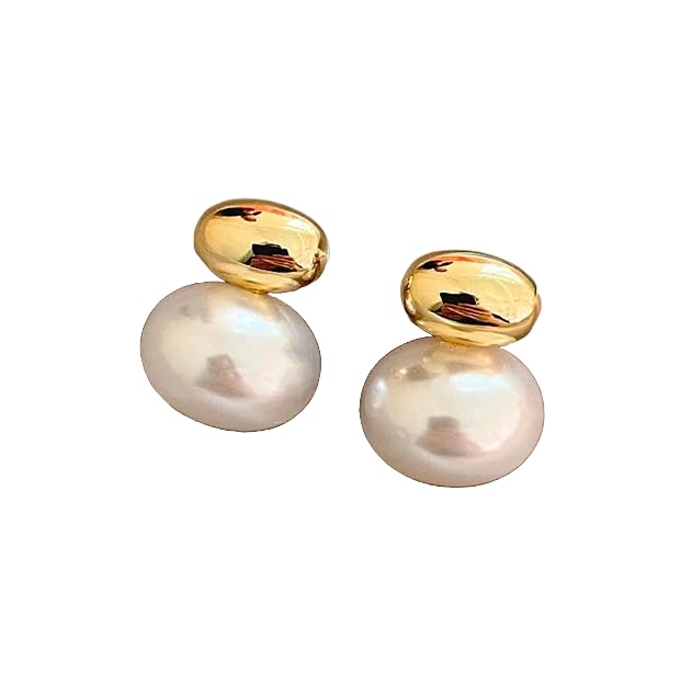 White pearl earrings resting on soft white cloth