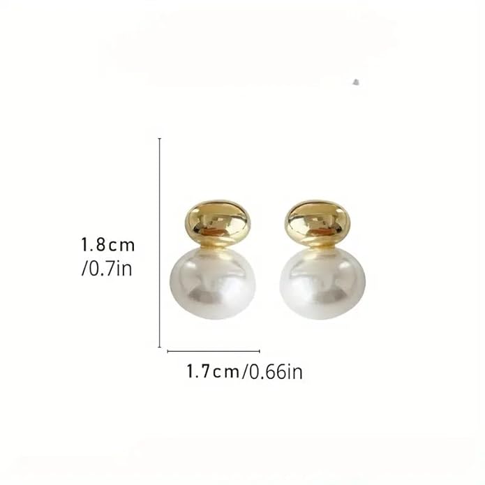 Classic white pearl earrings displayed on white fabric