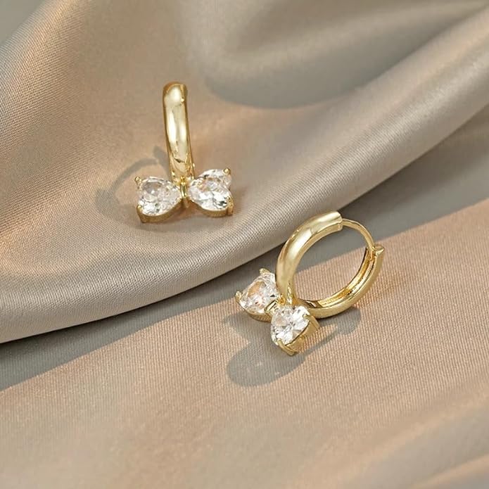 Chic gold plated earrings with dazzling white crystals.