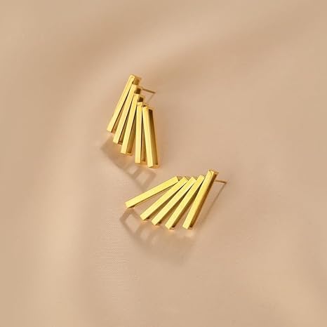 Thin metal strips transformed into gold plated earrings.