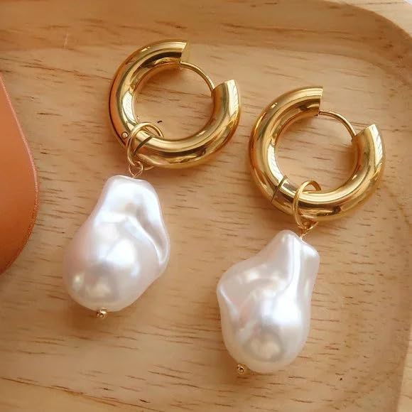 Two gold hoop earrings with white pearls, elegant jewelry accessories for a sophisticated look.