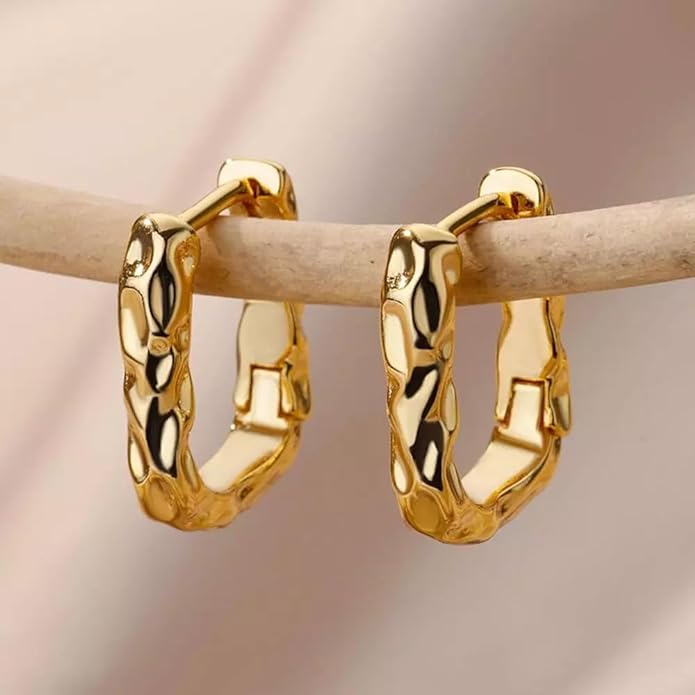 Shiny gold plated hoop earrings on a white background.