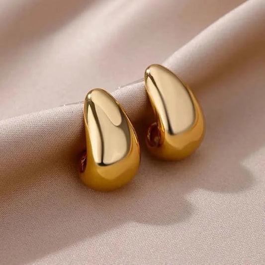 Gold tone tear drop earrings on white background. 2. Shiny gold tone tear drop earrings for pierced ears.