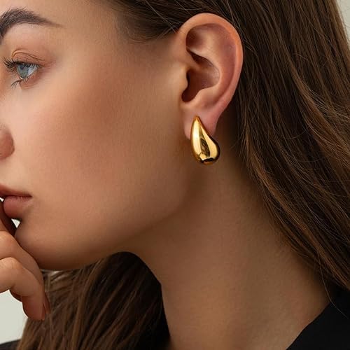 Beautiful gold tone tear drop earrings, a timeless accessory.