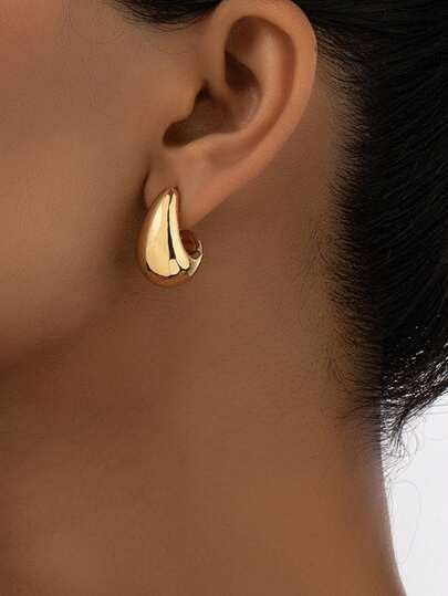 Stylish gold tone tear drop earrings, perfect for any occasion.