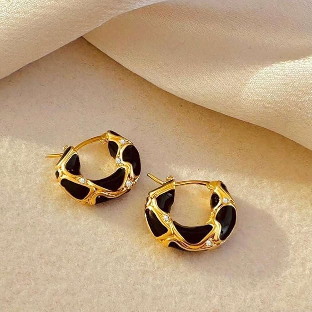 Gold plated hoop earrings with black enamel.