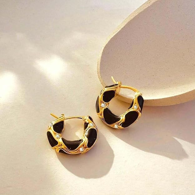 Stylish gold plated hoop earrings with black enamel.