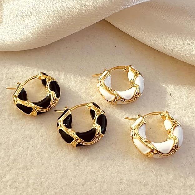 Stylish gold plated hoop earrings with black enamel, perfect for adding a touch of elegance to any outfit.