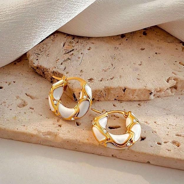 Pair of gold hoop earrings with white stones.