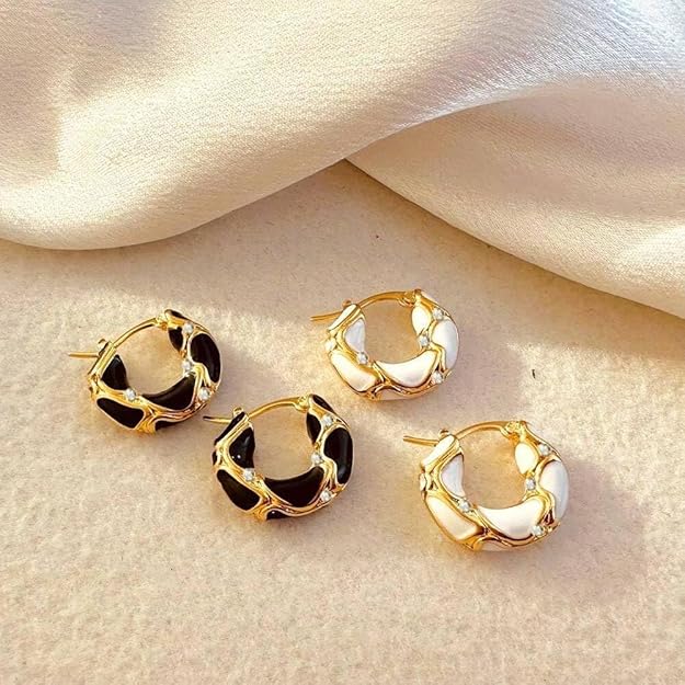 Gold earrings with white stones, in hoop style.