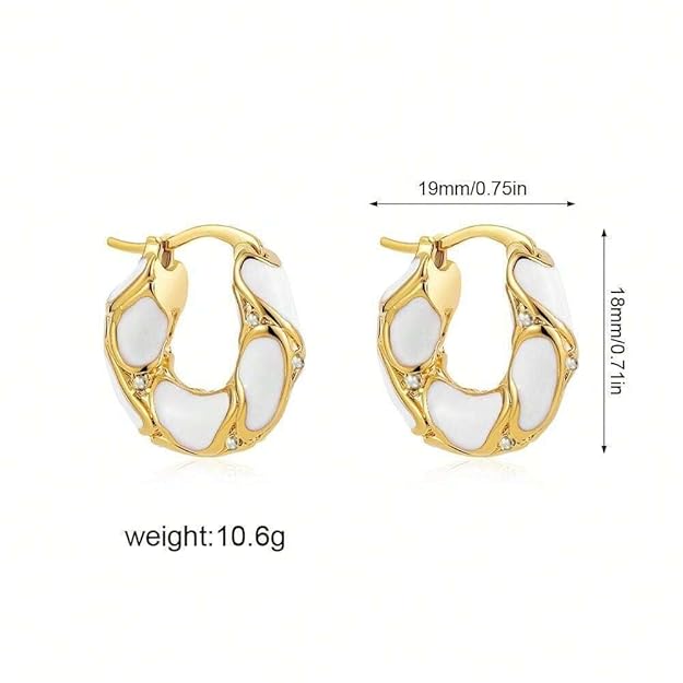  Earrings featuring gold hoops and white stones.