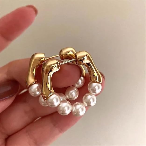  Classic pearl hoop earrings, a versatile piece that can be dressed up or down.