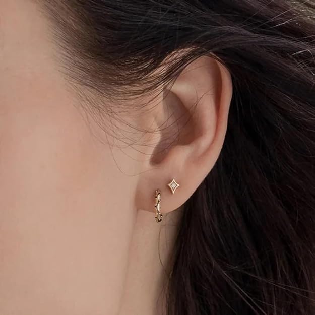 Stylish gold hoops featuring lovely pink stones, ideal for a chic and feminine look.