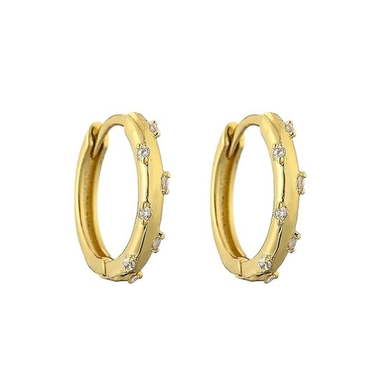 Gold hoop earrings with sparkling diamonds, perfect for adding a touch of elegance to any outfit.