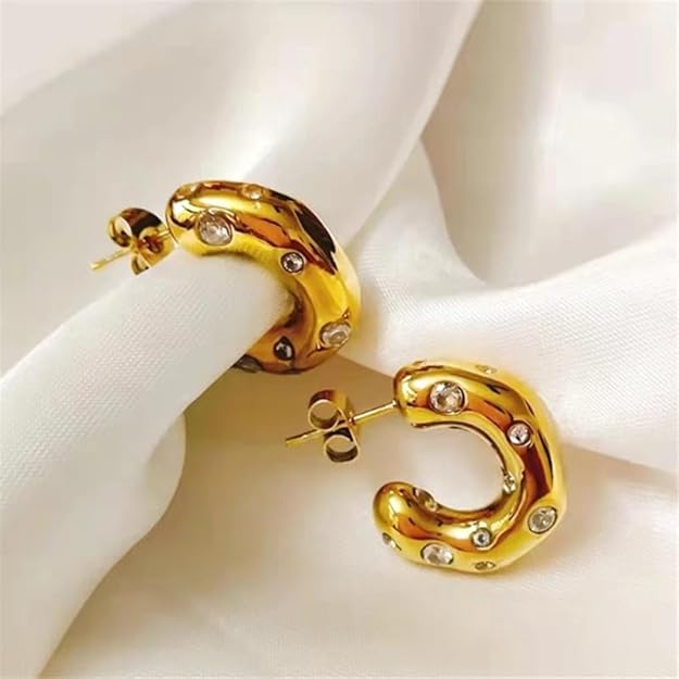 Shiny gold plated hoop earrings with sparkling diamonds, perfect for adding a touch of elegance to any outfit.