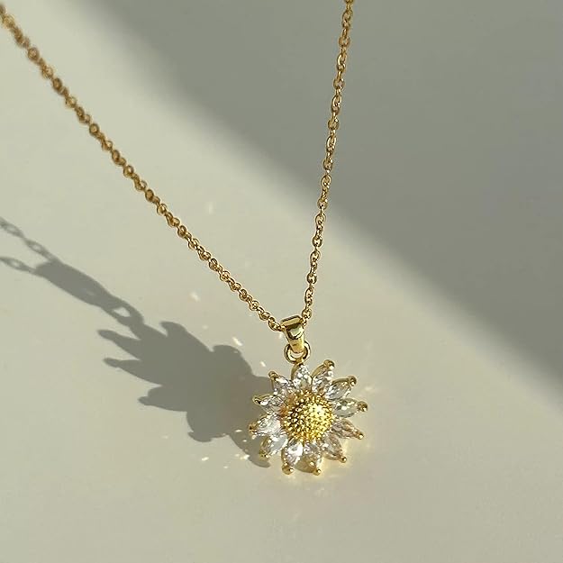 Gold necklace with sunflower pendant, perfect accessory for a sunny day.