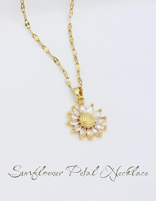 Add a touch of elegance to your ensemble with a gold necklace showcasing a lovely sunflower pendant.