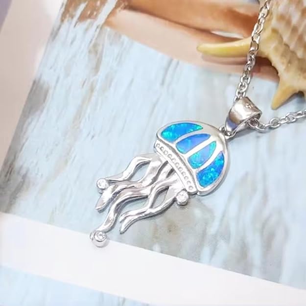  A jellyfish pendant with a blue shell design, perfect for ocean lovers.